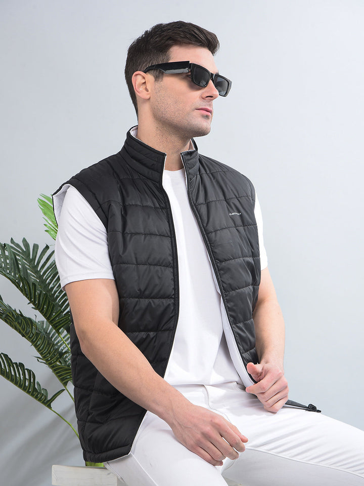 cobb solid black white sleeveless reversible jacket