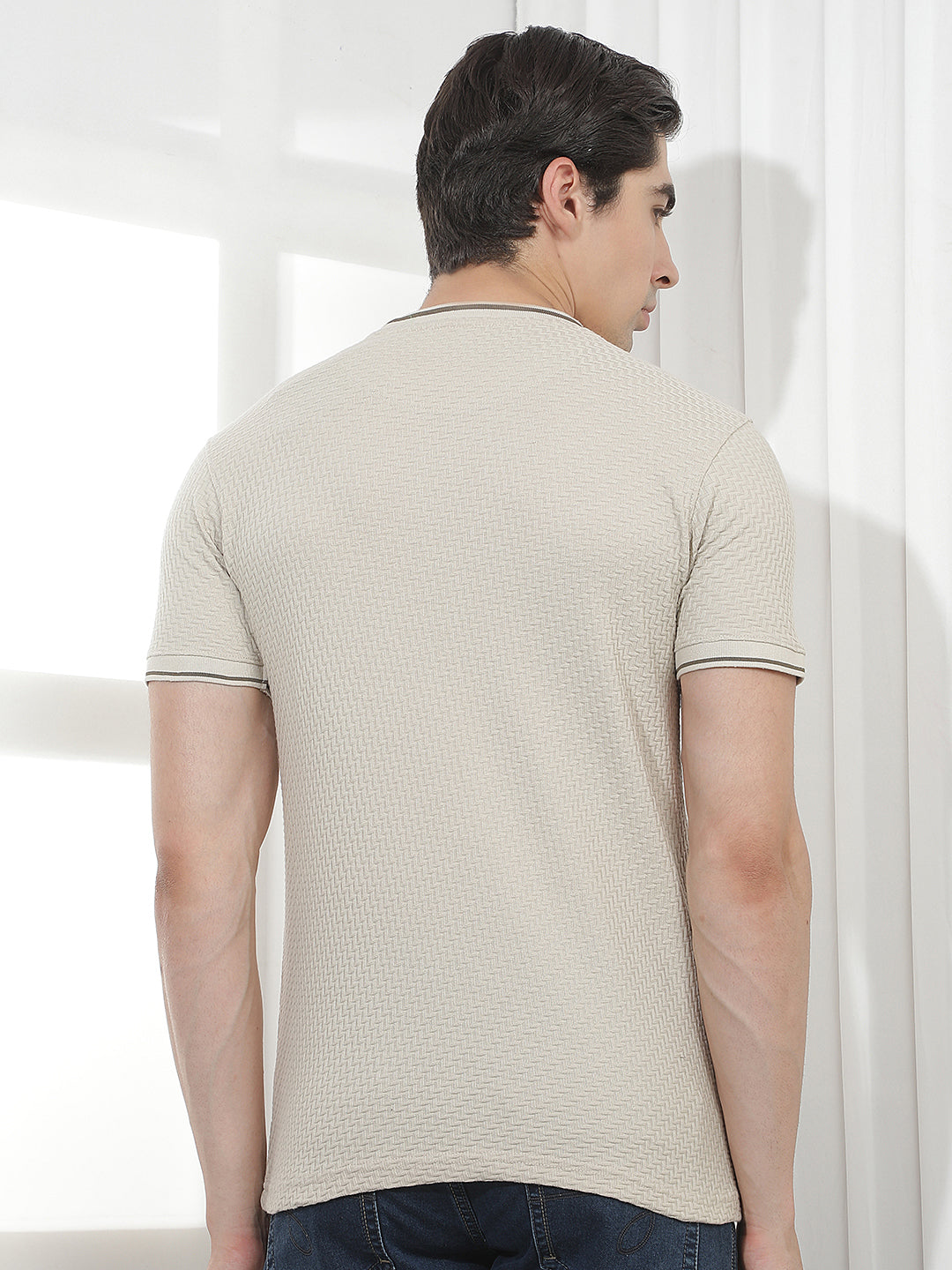 beige self-design round tees